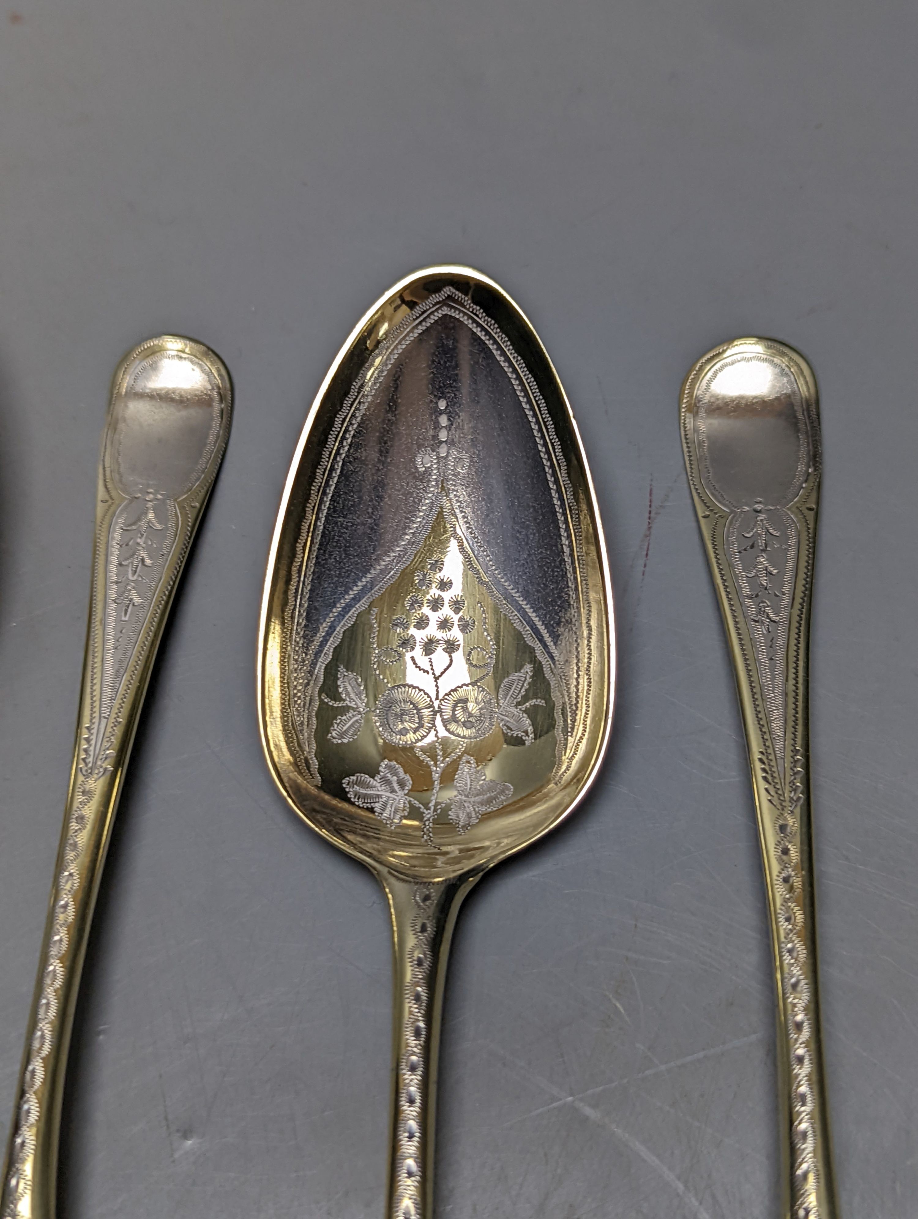 A set of 4 George III parcel gilt silver spoons, with engraved decoration, Thomas Northcote, London, 1796, 21.2cm